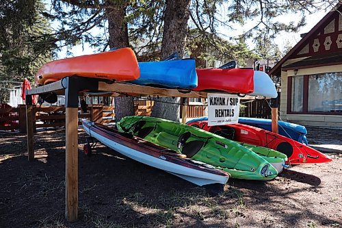 09052024
Kayaks and stand-up paddle boards offered for rent at Cycle Creek Outdoor Supply in Wasagaming. Parks Canada announced on Thursday that all personal watercraft, including motorized boats, canoes, kayaks and paddle boards, will be banned from use on Clear Lake for the 2024 season as part of work to determine whether invasive zebra mussels have established a presence in the lake.   (Tim Smith/The Brandon Sun)