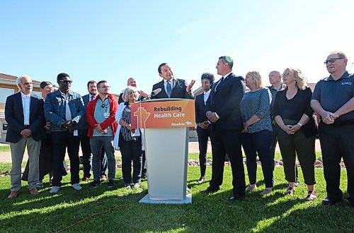 During a press conference in Carberry on Friday morning to announce the reopening of the community's emergency room, Manitoba Premier Wab Kinew shrugs his shoulders in imitation of Carberry Mayor Ray Muirhead as he recounted their first meeting several months ago when the subject of the Carberry Health Centre came up.  (Matt Goerzen/The Brandon Sun)