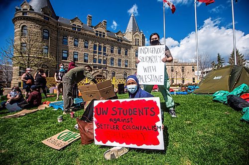 MIKAELA MACKENZIE / FREE PRESS

U of W student Ridwan Bashir (centre) and encampment participant Kapanaise Thiebaut (right) hold signs at a pro-Palestinian encampment at the University of Winnipeg on Friday, May 10, 2024. 

For Jen story.

