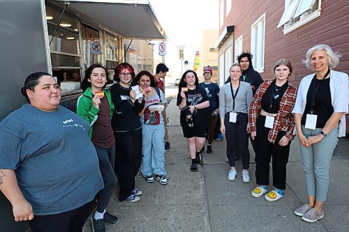 Left: Huddle Brandon's peer supporter Anita Labonte and some youth pose for a picture by the food truck on Friday. Photos: Abiola Odutola/The Brandon Sun