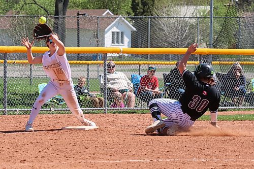 Westman Magic shortstop Kylan Solomon of Yellowhead (17) covers third base as sliding Eastman Wildcats base runner Morgan Plett of Landmark (30) slides safely into the bag on Sunday afternoon in Manitoba Premier Softball under-17 AAA action at Ashley Neufeld Softball Complex. (Perry Bergson/The Brandon Sun)
May 12, 2024