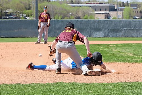 Souris Sabres base runner Nolan Janz (18) slides safely into third base as Crocus Plainsmen third baseman Nick Kaczmar (16) awaits the throw from the outfield during a Prairie West High School baseball League game at Andrews Field on Sunday afternoon as second baseman Bennett Ashmead looks on. (Perry Bergson/The Brandon Sun)
May 12, 2024
