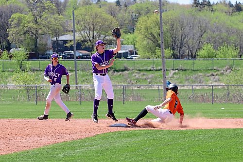 Vincent Massey Vikings shortstop Cason Burton (11) jumps to catch a throw from the plate as Killarney Raiders base runner Drew Shiels (2) slides safely into the bag for a stolen base during a Prairie West High School baseball League game at Don Sumner Field on Sunday afternoon as second baseman Jonah Lemoine (5) backs up the play. (Perry Bergson/The Brandon Sun)
May 12, 2024