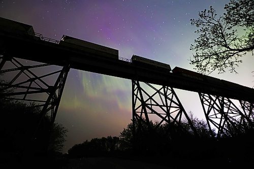 A stopped freight train atop the railway trestle at Rivers, MB is silhouetted against the stars as the aurora borealis dance in the western sky late Saturday night. A severe geomagnetic storm &#x2014;&#xa0;the strongest the earth has seen in 20 years &#x2014;&#xa0;caused northern lights to be seen across the northern hemisphere this past weekend, as a result of several solar flares exploding off the Sun. (Matt Goerzen/The Brandon Sun)