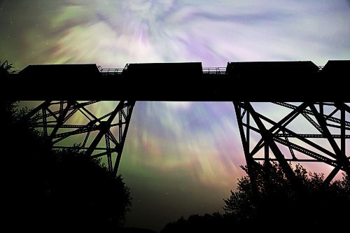 A stopped freight train atop the railway trestle at Rivers, MB is silhouetted against dancing aurora borealis in the night sky late Saturday. A severe geomagnetic storm &#x2014;&#xa0;the strongest the earth has seen in 20 years &#x2014;&#xa0;caused northern lights to be seen across the northern hemisphere this past weekend, as a result of several solar flares exploding off the Sun. (Matt Goerzen/The Brandon Sun)