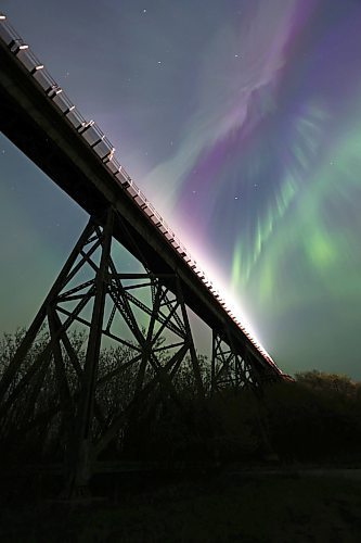 Headlights from a moving freight train brighten the top of the railway trestle at Rivers, MB, underneath a spectacular light show from the aurora borealis early Sunday morning. A severe geomagnetic storm &#x2014;&#xa0;the strongest the earth has seen in 20 years &#x2014;&#xa0;caused northern lights to be seen across the northern hemisphere this past weekend, as a result of several solar flares exploding off the Sun. (Matt Goerzen/The Brandon Sun)