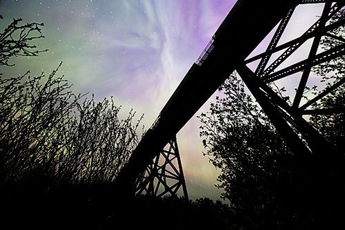 A stopped freight train atop the railway trestle at Rivers, MB is silhouetted against dancing aurora borealis in the night sky late Saturday. A severe geomagnetic storm &#x2014;&#xa0;the strongest the earth has seen in 20 years &#x2014;&#xa0;caused northern lights to be seen across the northern hemisphere this past weekend, as a result of several solar flares exploding off the Sun. (Matt Goerzen/The Brandon Sun)