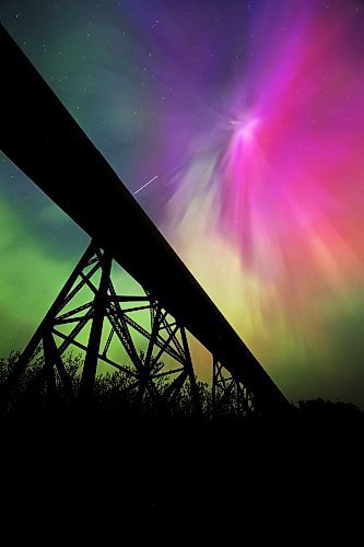 The iconic railway trestle at Rivers, MB is silhouetted against the pink, yellow, purple and green hues of a particularly strong aurora borealis early Sunday morning. An intense geomagnetic storm &#x2014;&#xa0;caused by several strong coronal mass ejections from the Sun's outer atmosphere &#x2014;&#xa0;hit the Earth's northern hemisphere over the weekend, creating spectacular night shows across Canada and the United States. It's the strongest storm of its kind to hit the planet in more than 20 years according to The Weather Network. (Matt Goerzen/The Brandon Sun)