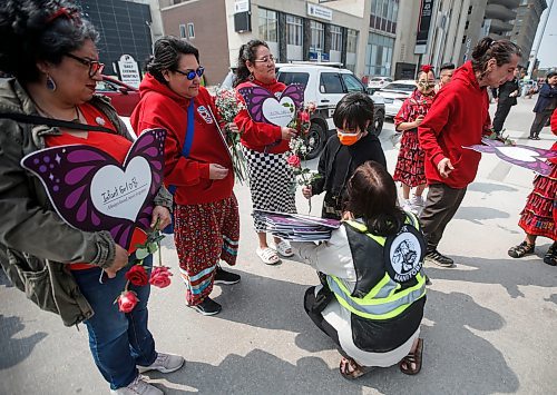 JOHN WOODS / FREE PRESS
family and supporters of MMIWGs walk past the site of the former St Regis Hotel to the Forks for ceremonies in support of families in Winnipeg Sunday, May 12, 2024. The annual event was created  twenty years ago after Sunshine Wood went missing from the St Regis hotel.

Reporter: Tyler