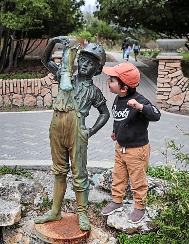Ruth Bonneville / Free Press
Local - Boy with boot
Jackson Grusko, 3yrs, gets a closer look at the Boy with the Boot statue at the entrance to the Assiniboine Park's English Garden Monday. Jackson was hanging out with his mom and Bubbie (grandmother) exploring the duck pond and the English Garden for the afternoon,
The Boy with the Boot statue is one of several structures that are being considered for heritage status. See story.
May 13th, 2024