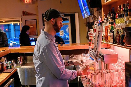 Mike Sudoma/Free Press
Co owner Jesse Kowalski pours a beer for a patron at The Handsome Daughter Sunday evening
May 12, 2024