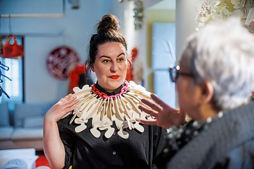 MIKE DEAL / FREE PRESS
Columnist Jen Zoratti tries on one of the necklaces.
Tijen Roshko is the Winnipeg founder and designer behind Kolye TJN, and she just launched her new line at an invite-only event earlier this month.
See Jen Zoratti story
240514 - Tuesday, May 14, 2024.