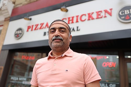 Manager Imtiaz Ahmad stands in front of Pizza & Chicken by Kanwal at 935 A Rosser Ave. in downtown Brandon on Wednesday. (Abiola Odutola/The Brandon Sun)