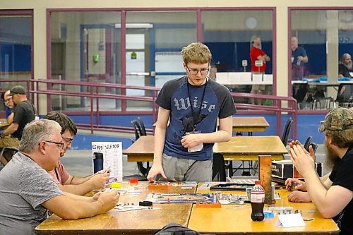 Colin Kennedy takes part in a round of Terraforming Mars during the opening day of PrairieCon 2023. Brandon's preeminent tabletop gaming convention is in its 42nd year and will be taking place throughout the weekend at the Brandon Curling Club. (Kyle Darbyson/The Brandon Sun)