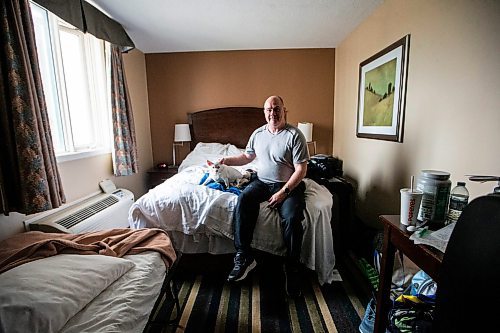 MIKAELA MACKENZIE / FREE PRESS

Des Kappel, displaced resident from Birchwood Terrace, with his dog Nemo in the hotel room they are currently staying in on Wednesday, May 15, 2024. 

For Tyler story.

