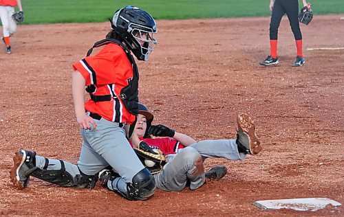Out at the plate, this runner tagged out well short of his slide home during a U13 Baseball Brandon house league game at Simplot Millenium Park. (Jules Xavier/The Brandon Sun)