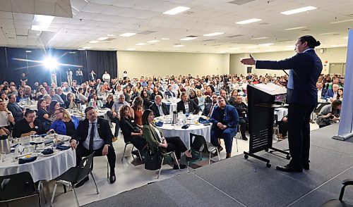 A business crowd listens intently to Manitoba Premier Wab Kinew while he delivers the state of the province speech to a packed house during a Brandon Chamber of Commerce luncheon at the Keystone Centre on Thursday. (Matt Goerzen/The Brandon Sun)