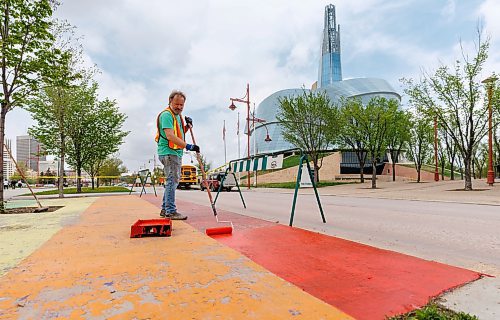 MIKE DEAL / FREE PRESS
James Culleton paints the rainbow flag onto the sidewalk at The Forks, something he has been doing for many years.
James Culleton has been making art in public for close to 30 years in Winnipeg, but his latest work has gotten the multi-disciplinary artist newfound attention. During the ongoing trial of Jeremy Skibicki, Culleton has served as courtroom artist, bringing his own sketch style to one of the most high profile criminal proceedings in modern Manitoban history.
See Ben Waldman story
240516 - Thursday, May 16, 2024.