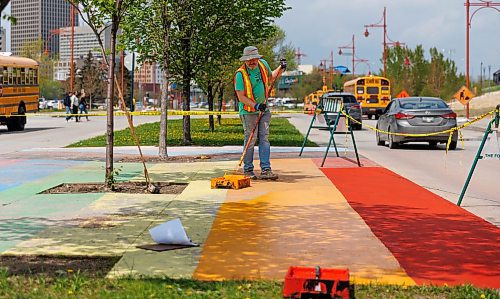 MIKE DEAL / FREE PRESS
James Culleton paints the rainbow flag onto the sidewalk at The Forks, something he has been doing for many years.
James Culleton has been making art in public for close to 30 years in Winnipeg, but his latest work has gotten the multi-disciplinary artist newfound attention. During the ongoing trial of Jeremy Skibicki, Culleton has served as courtroom artist, bringing his own sketch style to one of the most high profile criminal proceedings in modern Manitoban history.
See Ben Waldman story
240516 - Thursday, May 16, 2024.