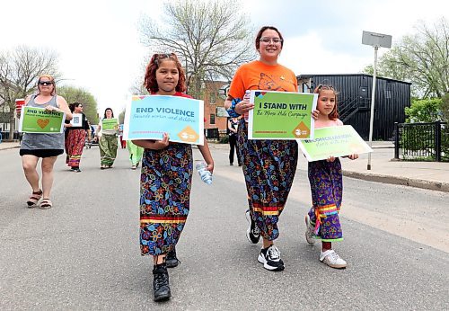 Abaloney Skye McArthur walks with two of her five children for the Moose Hide Day march down Princess Avenue on Thursday afternoon. Moose Hid Day is a day of ceremony for Canadians to come together to take a stand against violance towards women and children, along the journey to reconciliation. (Matt Goerzen/The Brandon Sun)