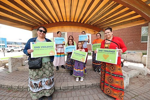 Tanya Wanbdiska, left and her sister Crystal Taylor, far right, stand with Taylor's daughter Abaoloney Skye McArthur and her five children before the start of the Moose Hide Campaign march at Princess Park on Thursday afternoon. (Matt Goerzen/The Brandon Sun)