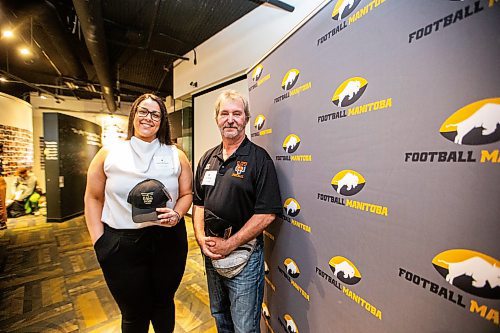 MIKAELA MACKENZIE / FREE PRESS

New Football Hall of Fame inductees Andrea Backlund and Brian Marks at the Sport Manitoba building in on Thursday, May 16, 2024. 

For Josh story.

