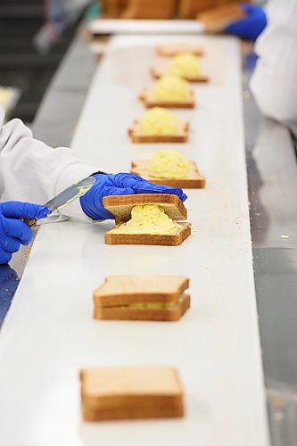 Mike Sudoma/Free Press
A worker clothes a sandwich on a conveyer belt like workspace Wednesday afternoon.
May 15, 2024