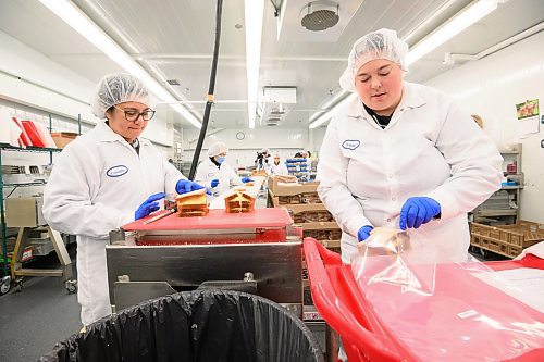 Mike Sudoma/Free Press
WRHA Food and Nutrition workers Criselda (left) and Ashely (right) assemble and package egg salad sandwiches before they are delivered to patients in Winnipeg
May 15, 2024