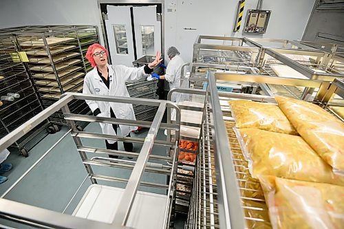 Mike Sudoma/Free Press
WRHA Regional Manager Charity Hanslit showcases racks of ingredients in a food storage freezer inside of the WRHA Food Distribution Centre Wednesday
May 15, 2024