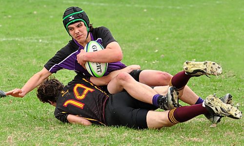 In a physical contest for cross-town bragging rights, Crocus Plainsmen tackler Keenan Molyneux (14) slows a Vincent Massey opponent during half action Friday afternoon. Following the final whistle, the Plainsmen scored a 34-12 triumph over the Vikings. (Jules Xavier/The Brandon Sun)