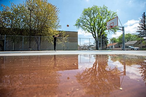 MIKAELA MACKENZIE / FREE PRESS

Luigi Del Rosario shoots hoops as the sun dries the court between rainstorms at the Weston Memorial Community Centre on Friday, May 17, 2024.

Standup.

