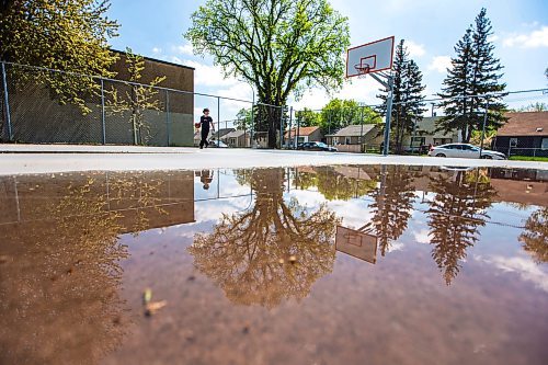 MIKAELA MACKENZIE / FREE PRESS

Luigi Del Rosario shoots hoops as the sun dries the court between rainstorms at the Weston Memorial Community Centre on Friday, May 17, 2024.

Standup.

