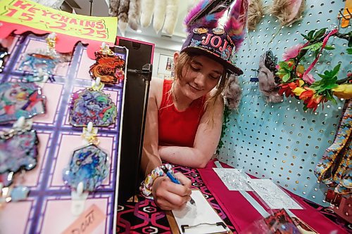 JOHN WOODS / FREE PRESS
Anya Repko, artist who owns Loaf of Cake, works on a new piece as she sells her art in the market at Keycon at a Winnipeg hotel Sunday, May 19, 2024. 

Reporter: standup