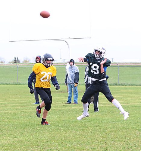 Roughriders quarterback Haiden Samuels (19, dark green) launches a pass as Ticats defender Kade Nielson (20, gold) pursues him during Westman Youth Football Association action at Boyd Stadium on a rainy and windy Saturday afternoon. The Ticats earned a 7-0 victory. (Perry Bergson/The Brandon Sun)
May 19, 2024