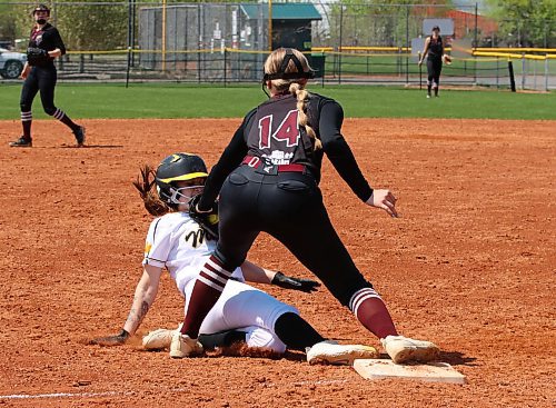 Westman Magic base runner Kailyn Lang (12) of Brandon is tagged out by Manitoba Phillies third baseman Anya English of St. Eustache (14) in a close play during under-19 AAA Manitoba Premier Softball League action at Ashley Neufeld Softball Complex on Sunday afternoon. The Magic lost that battle but won the war by sweeping the doubleheader, with Lang earning the win on the mound in the first game. (Perry Bergson/The Brandon Sun)
May 19, 2024