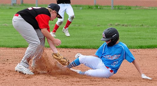 Cash Leslie (2) of the Brandon U13 AAA Marlins touched the base on a steal before Midwest second baseman Carter Chudley (42) could apply the tag during Game 1 of a doubleheader Sunday afternoon at Simplot Millenium Park. (Jules Xavier/The Brandon Sun)