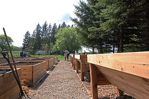 Vincent Tufts and his mother Amy Lees, who is the vice chair of the garden, at the end of the ramp that was installed to create better accessibility.  The official opening for the garden will be held May 31. (Charlotte McConkey/The Brandon Sun)