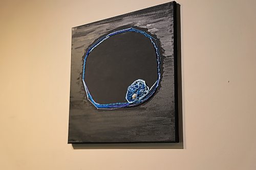 "where I left you behind," beadwork on acrylic painted canvas with a small rock and embroidery thread glued on. (Charlotte McConkey/The Brandon Sun)