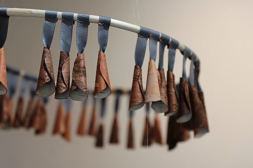 Details of "healing dress," which is made of birch bark cones, ribbon and a willow hoop. The work was part of Kristy Janvier's "The Weight We Carry" exhibition, which was hosted at Heritage Home for the Arts in Killarney this month. (Charlotte McConkey/The Brandon Sun)