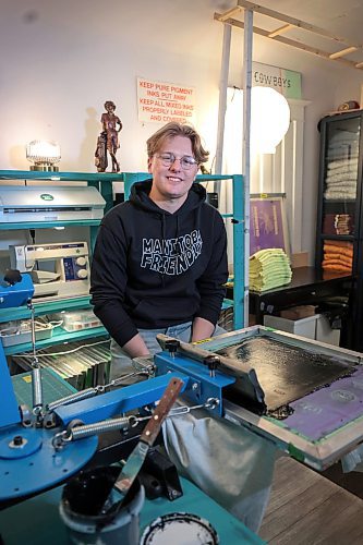 Ruth Bonneville / Free Press
Cole Wielgosz, the founder of Honey Dill Print Shop, goes through the process of screenprinting a shirt in his workshop. 