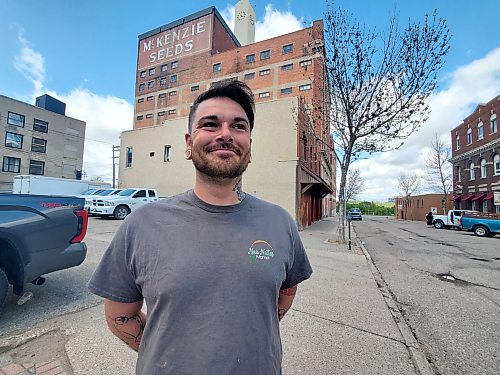 Neo Nutes Market owner Cody Ray stands outside the McKenzie Seeds building in downtown Brandon, where he plans to reopen his urban farm in 2025. (Abiola Odutola/The Brandon Sun)