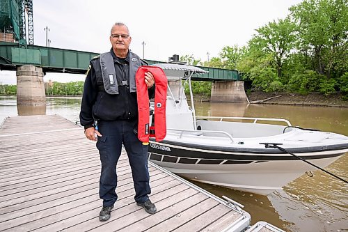 Mike Sudoma/Free Press
Constable of the WPS River Patrol, Ray Duma,in front of one of the boats he and his crew use to patrol the waterways 
May 22, 2024