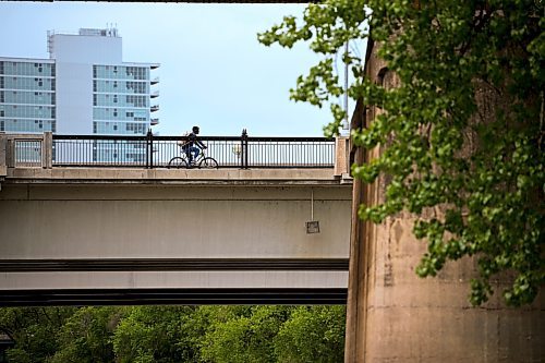 Mike Sudoma/Free Press
A cyclist rides northbound down the Midtown bridge near The Forks after Wednesday mornings rain shower
May 22, 2024