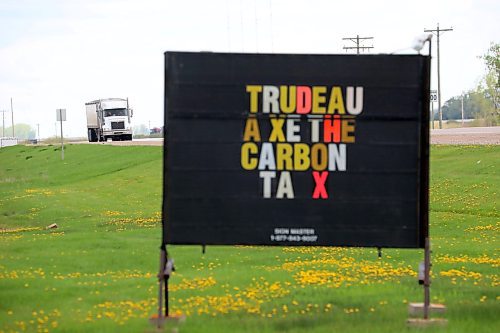 24052024
A semi trailer passes by a sign opposing the federal carbon tax on Highway 10 outside Boissevain on Wednesday.
(Tim Smith/The Brandon Sun)