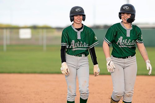 BROOK JONES / FREE PRESS
St. James A's (Yellow - female team) player Kirsten Giesbrecht (left) and Kennedy Morissette are all smiles during the team's home game against the St. James A's (Green) in Winnipeg Minor Baseball League 15U AA action at St. James Optimist Fields in Winnipeg, Man., Wednesday, May 22, 2024. The St. James A's (Yellow  - female team) earned their first win of the 2024 season after earning a 6-2 vicrtory over the St. James A's (Green).