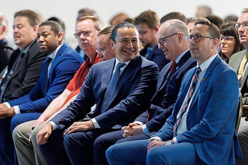 MIKE DEAL / FREE PRESS
Manitoba Premier Wab Kinew (centre) and Winnipeg Mayor Scott Gillingham (second from right) joined Ryan Kuffner (right), President &amp; CEO at Economic Development Winnipeg during the start of the EDW&#x2019;s AGM, Thursday morning.
240523 - Thursday, May 23, 2024.