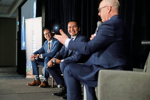 MIKE DEAL / FREE PRESS
Manitoba Premier Wab Kinew (centre) and Winnipeg Mayor Scott Gillingham (right) joined Ryan Kuffner (left), President &amp; CEO at Economic Development Winnipeg during the start of the EDW&#x2019;s AGM, Thursday morning.
240523 - Thursday, May 23, 2024.