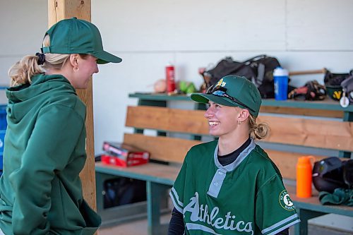 BROOK JONES / FREE PRESS
St. James A's (Yellow - female team) player Kirsten Giesbrecht (right) and first base coach Jamey Johnson are pictured in the dugout during the team's home game against the St. James A's (Green) in Winnipeg Minor Baseball League 15U AA action at St. James Optimist Fields in Winnipeg, Man., Wednesday, May 22, 2024. The St. James A's (Yellow  - female team) earned their first win of the 2024 season after earning a 6-2 vicrtory over the St. James A's (Green).