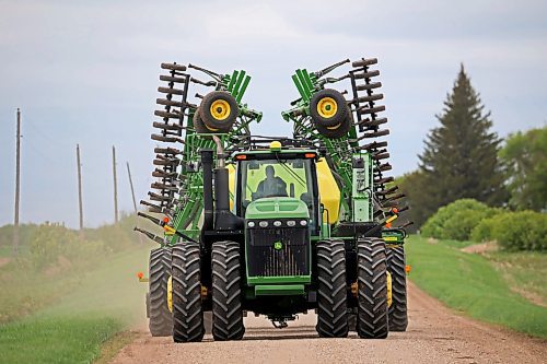 23052024
A farmer moves equipment along Kirkham Road west of Brandon on Thursday. 
(Tim Smith/The Brandon Sun)