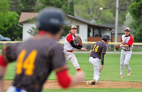 Boissevain Centennials infield turn a double play with outs on Brewers Avery Cullen (24) and Tyson Kozak (44) during South West Baseball League action Thursday night in Wawanesa. (Jules Xavier/The Brandon Sun)